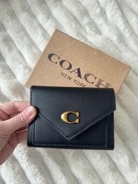 Coach Black Leather Trifold Wallet with Gold 'C' Accent